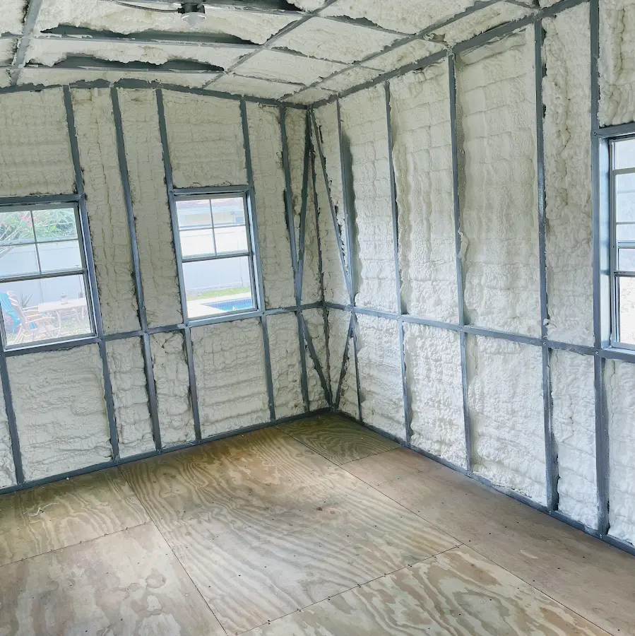 Closed-cell spray foam insulation applied to wall cavities in a residential project in Windsor